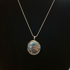 Handcrafted iridescent glass pendant on an 18 inch silver plated snake chain
